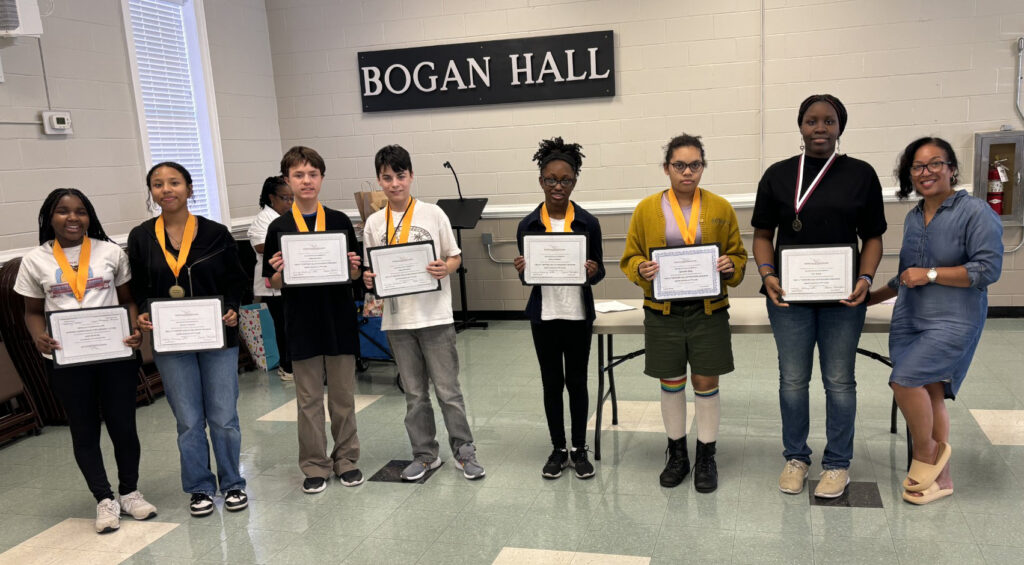 students holding certificates