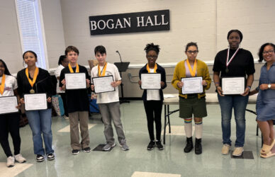 students holding certificates